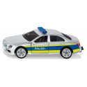 Juguete de patrulla de policía de metal y plástico con puertas que se abren y enganche para acoplar.