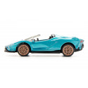 Miniatura de Lamborghini Sián Roadster turquesa con llantas doradas y techo abierto.
