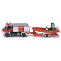 Camión de bomberos Unimog de juguete con remolque y barco flotante de metal y plástico.
