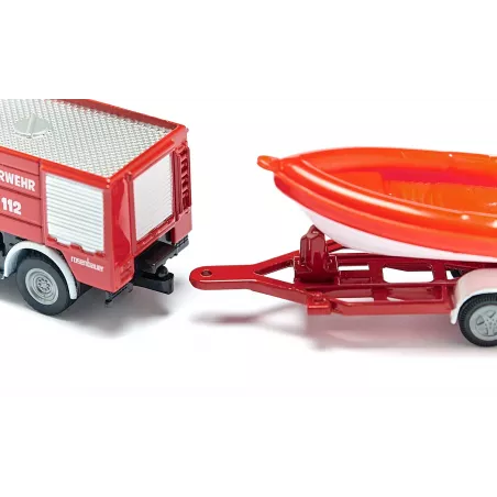 Camión de bomberos Unimog de juguete con remolque y barco flotante de metal y plástico.