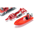 Camión de bomberos Unimog de juguete con remolque y barco flotante de metal y plástico.