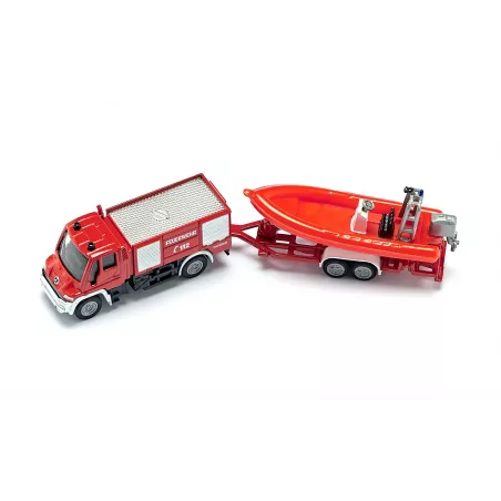 Camión de bomberos Unimog de juguete con remolque y barco flotante de metal y plástico.