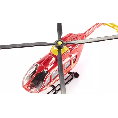 Helicóptero ambulancia de juguete en miniatura fabricado de metal y plástico resistente.