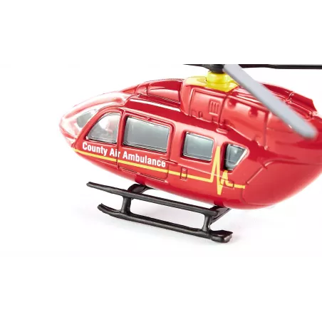 Helicóptero ambulancia de juguete en miniatura fabricado de metal y plástico resistente.