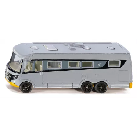 Autobús de juguete de metal y plástico con sistema de acoplamiento y detalles realistas.