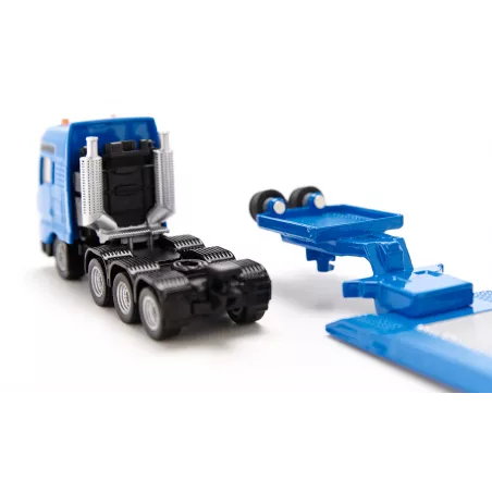 Excavadora de juguete Liebherr a escala 1:87 con chasis de orugas, pala y brazo móvil de metal y plástico.