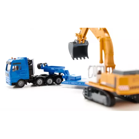 Excavadora de juguete Liebherr a escala 1:87 con chasis de orugas, pala y brazo móvil de metal y plástico.