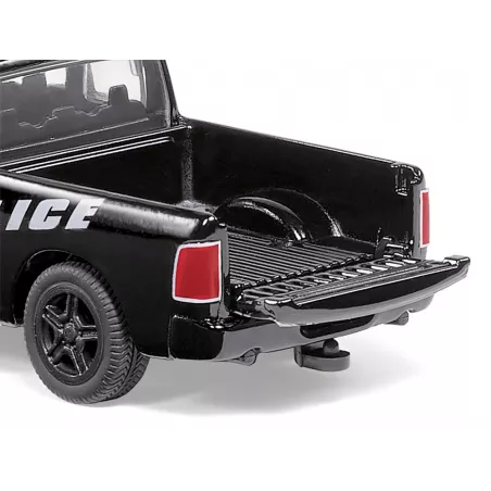 Coche de policía de juguete RAM 1500 a escala 1:50 con puertas que se abren y piezas de metal.