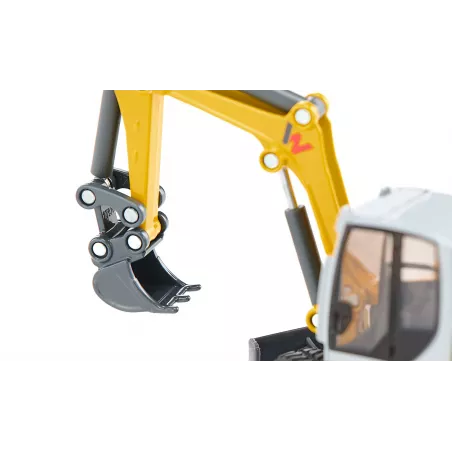 Excavadora de orugas de juguete Wacker Neuson ET65 a escala 1:50 con brazo móvil y pala funcional.