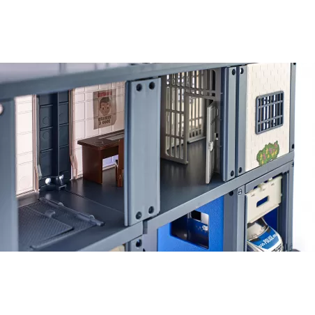 Estación de policía de juguete ampliable con piezas de metal y plástico detalladas.