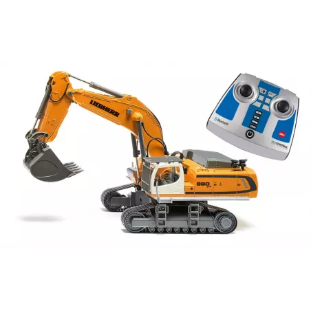 Excavadora teledirigida Liebherr R980 RC a escala 1:32 con brazo móvil y chasis de orugas.