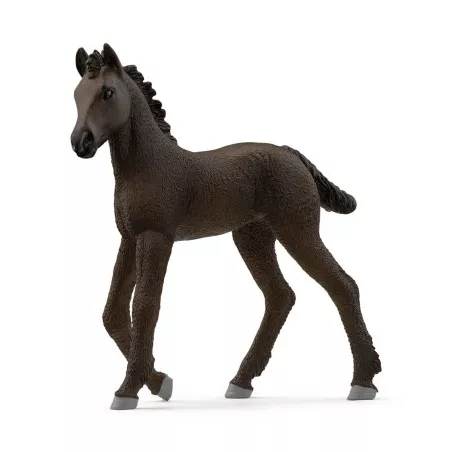 Potro frisón de juguete Schleich con pelaje negro azabache en postura curiosa.