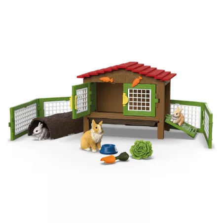 Jaula para conejos de juguete Schleich con figuras de conejitos y accesorios de granja.