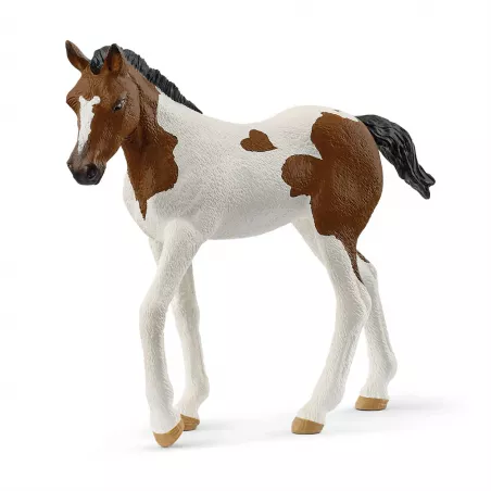 Figura de juguete de potro Paint Horse de Schleich pintada a mano con detalles realistas.