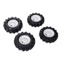 Set de cuatro neumáticos de aire rollyTrac para tractores de pedales infantiles que mejoran la tracción.