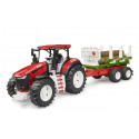 Tractor de juguete Roadmax con remolque autocargador y tres troncos de madera.