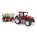 Tractor Roadmax de juguete con remolque autocargador basculante y tres troncos de madera.