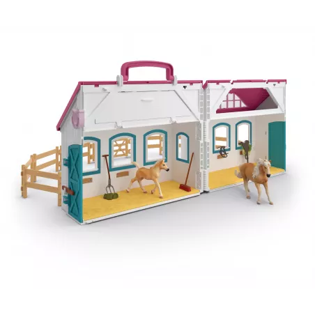 Establo abierto portátil de juguete Schleich con figuras de yegua y potro Haflinger.
