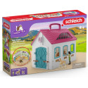 Establo abierto portátil de juguete Schleich con figuras de yegua y potro Haflinger.