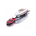 Ford F150 de juguete a escala 1:50 con remolque y lancha motora que flota en el agua.