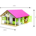 Establo de juguete de madera rosa con dos compartimentos y techo abatible a escala 1:24.
