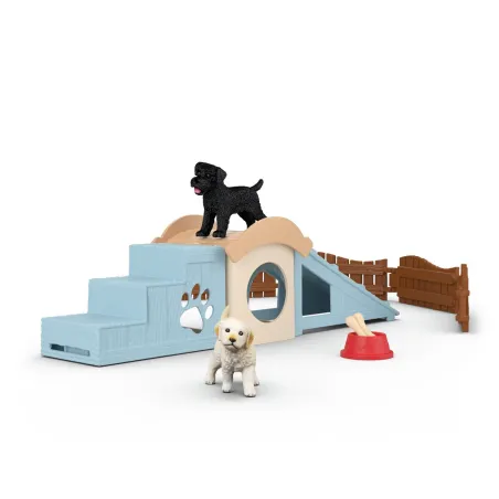 Parque de juegos para cachorros Schleich con rampa, escaleras y figuras de perritos de juguete.