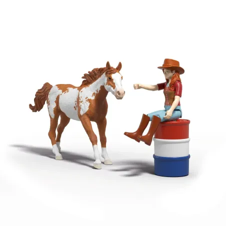 Set de juego Schleich La aventura en el oeste de Hannah con caballo Paint Horse y obstáculos de rodeo.