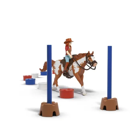 Set de juego Schleich La aventura en el oeste de Hannah con caballo Paint Horse y obstáculos de rodeo.