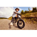 Bicicleta infantil BERG Bike Cross gris con freno de mano de alta precisión y diseño ergonómico ajustable.