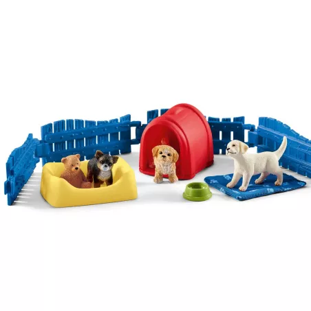 Recinto para cachorros Schleich con tres perros de juguete, caseta y accesorios
