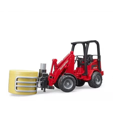 Cargadora articulada Schäffer Hoflader 2034 de Bruder a escala 1:16 con pinza funcional para pacas de heno.