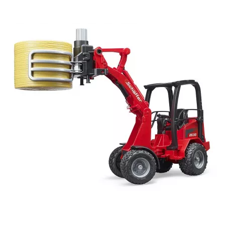 Cargadora articulada Schäffer Hoflader 2034 de Bruder a escala 1:16 con pinza funcional para pacas de heno.