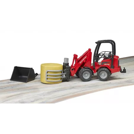 Cargadora articulada Schäffer Hoflader 2034 de Bruder a escala 1:16 con pinza funcional para pacas de heno.