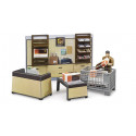 Tienda de paquetería UPS bworld de Bruder a escala 1:16 con figura de empleado, mostrador, báscula y paquetes.