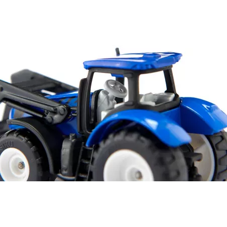Tractor de juguete New Holland con horquilla delantera, miniatura de metal y plástico resistente.