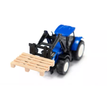 Tractor de juguete New Holland con horquilla delantera, miniatura de metal y plástico resistente.