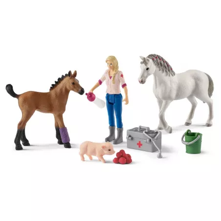 Veterinaria curando a una yegua y su potro con accesorios médicos, set de juguete Schleich.