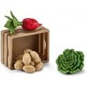 Set de juguete Schleich de comida para cerdos con remolacha, patatas, ensalada y comedero de granja.
