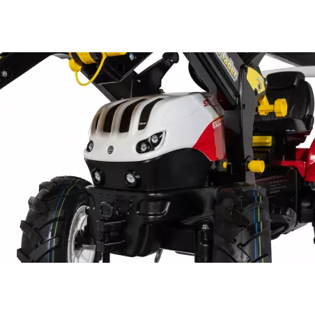 Tractor de pedales infantil Steyr 6300 Terrus CVT con pala cargadora delantera para niños de 3 a 8 años.