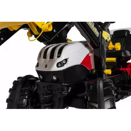 Tractor a pedales Steyr 6300 Terrus CVT con pala frontal de juguete para niños.