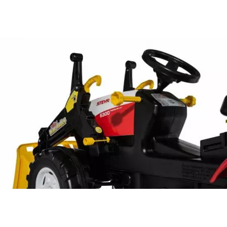 Tractor a pedales Steyr 6300 Terrus CVT con pala frontal de juguete para niños.