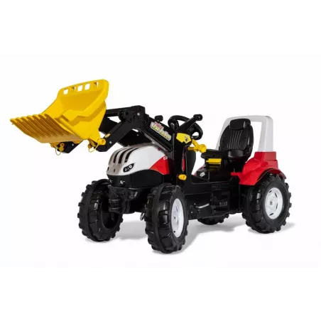 Tractor a pedales Steyr 6300 Terrus CVT con pala frontal de juguete para niños.