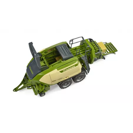 Empacadora de juguete Krone BiG Pack 1290HDP VC de Bruder a escala 1:16 con dos pacas de heno.