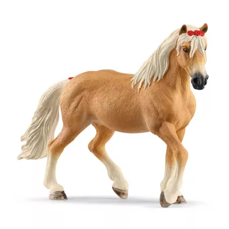 Yegua Haflinger de juguete Schleich con crin blanca detallada y lazo rojo