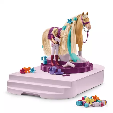Estación de aseo de caballos de juguete Schleich con cepillos, secador y accesorios decorativos para equinos.