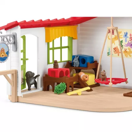 Set de juego hotel de animales Schleich con figuras de mascotas y circuito de agilidad.