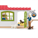 Set de juego hotel de animales Schleich con figuras de mascotas y circuito de agilidad.