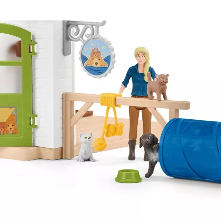 Set de juego hotel de animales Schleich con figuras de mascotas y circuito de agilidad.