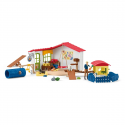 Set de juego hotel de animales Schleich con figuras de mascotas y circuito de agilidad.