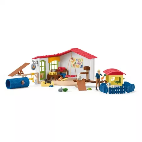 Set de juego hotel de animales Schleich con figuras de mascotas y circuito de agilidad.